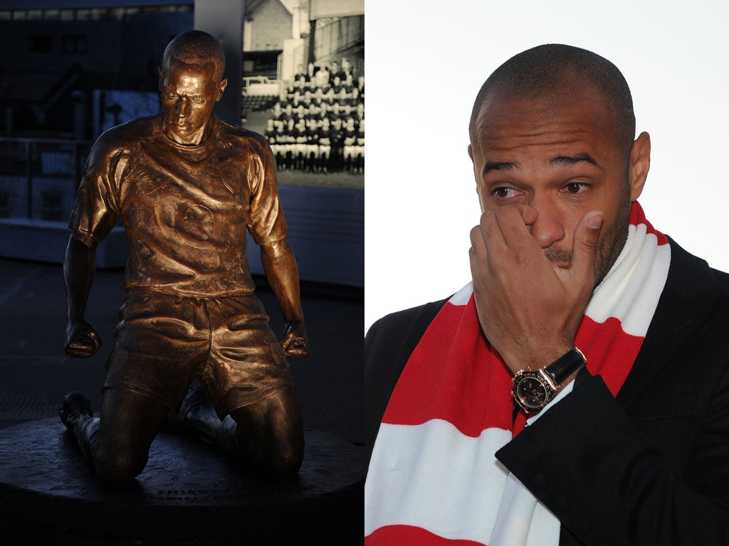 Thierry Henry shows his emotion as his statue is unveiled outside the Emirates Stadium as part of Arsenal's 125th birthday celebrations