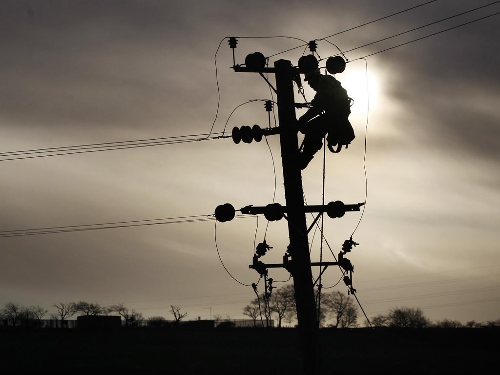 Repairing power lines in Scotland after storms cut off electricity to tens of thousands of homes