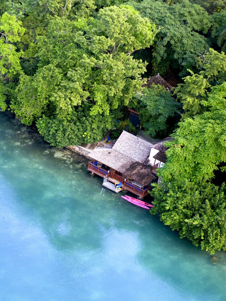 Goldeneye: What was once scrubby shoreline has been transformed into a sandy playground for the well-off