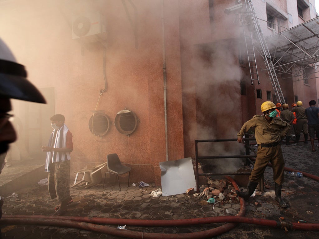 Firefighters at the scene of the hospital blaze in Calcutta yesterday