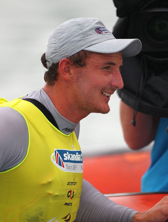 Smiles for Britain's Giles Scott as he wins the Finn heavyweight
single hander world championship off Fremantle, W Australia