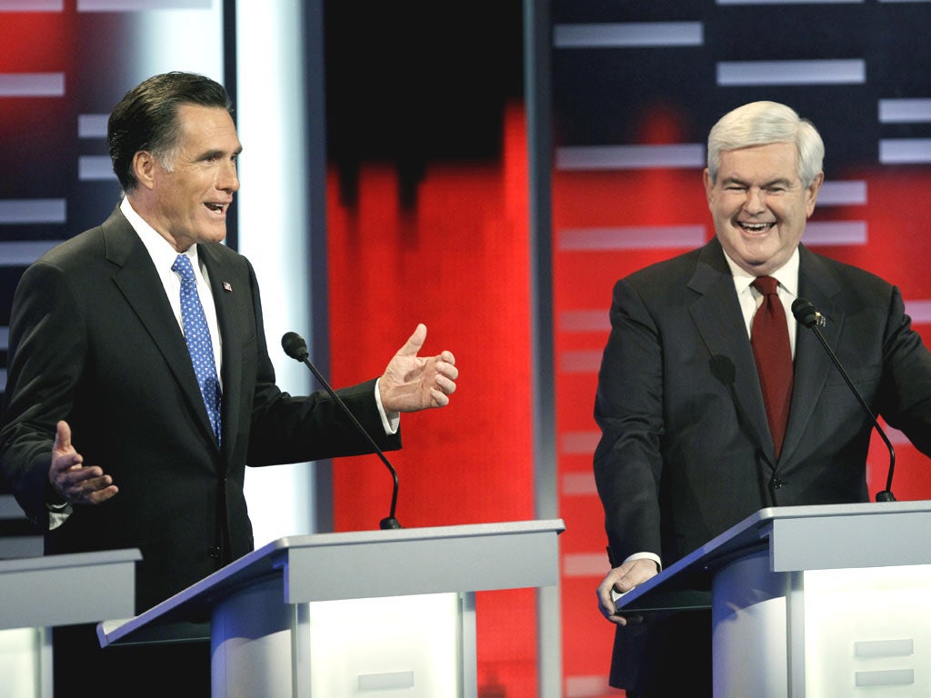 Mitt Romney, left, and Newt Gingrich during Saturday’s Republican debate in Des Moines