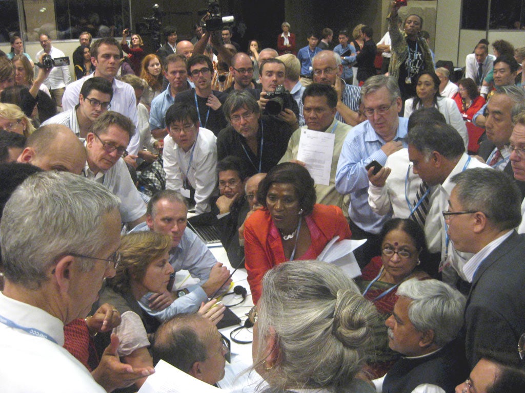 The deal was done at the International convention Centre on Sunday. The key players are Todd Stern, US Climate Envoy (front left, looking on), Connie Hedegaard, EU Climate Commissioner (seated at left, right hand raised), Jayanthi Natarajan, Indian Enviro