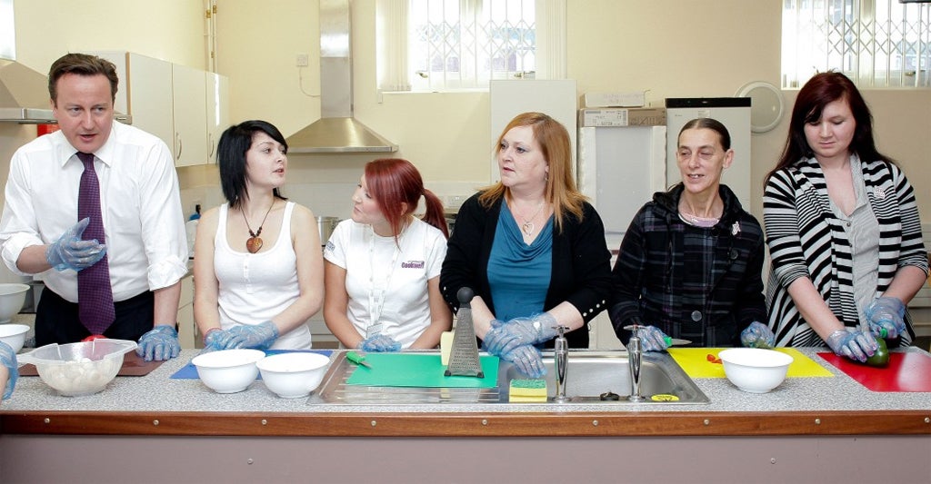 The PM prepares vegetables with the users of a community centre in Smethwick, West Midlands