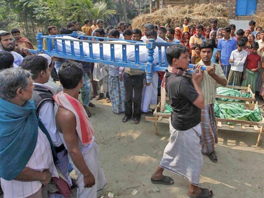 A funeral for one of the victims of the bootleg alcohol at a village outside Kolkata