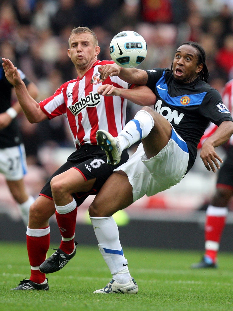 Lee Cattermole (left) will lead Sunderland out at Spurs - if selected