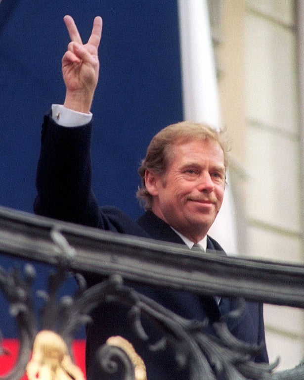 Victory: Havel salutes the crowd at Prague Castle following his election as the last president of Czechoslovakia in December 1989