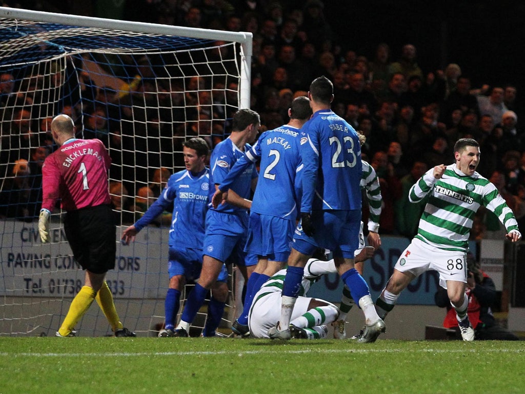 Celtic's Gary Hooper (right) turns away after scoring the opener