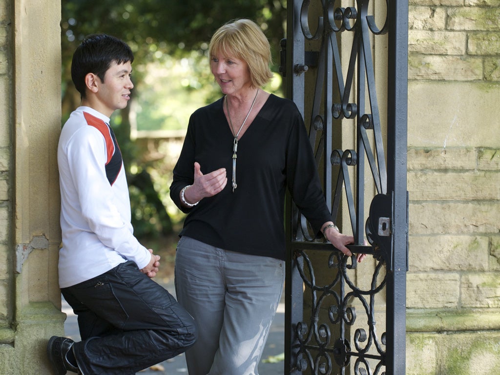 Far from home: Anne King with Abdul, now 20, who she fostered when he was a teenager