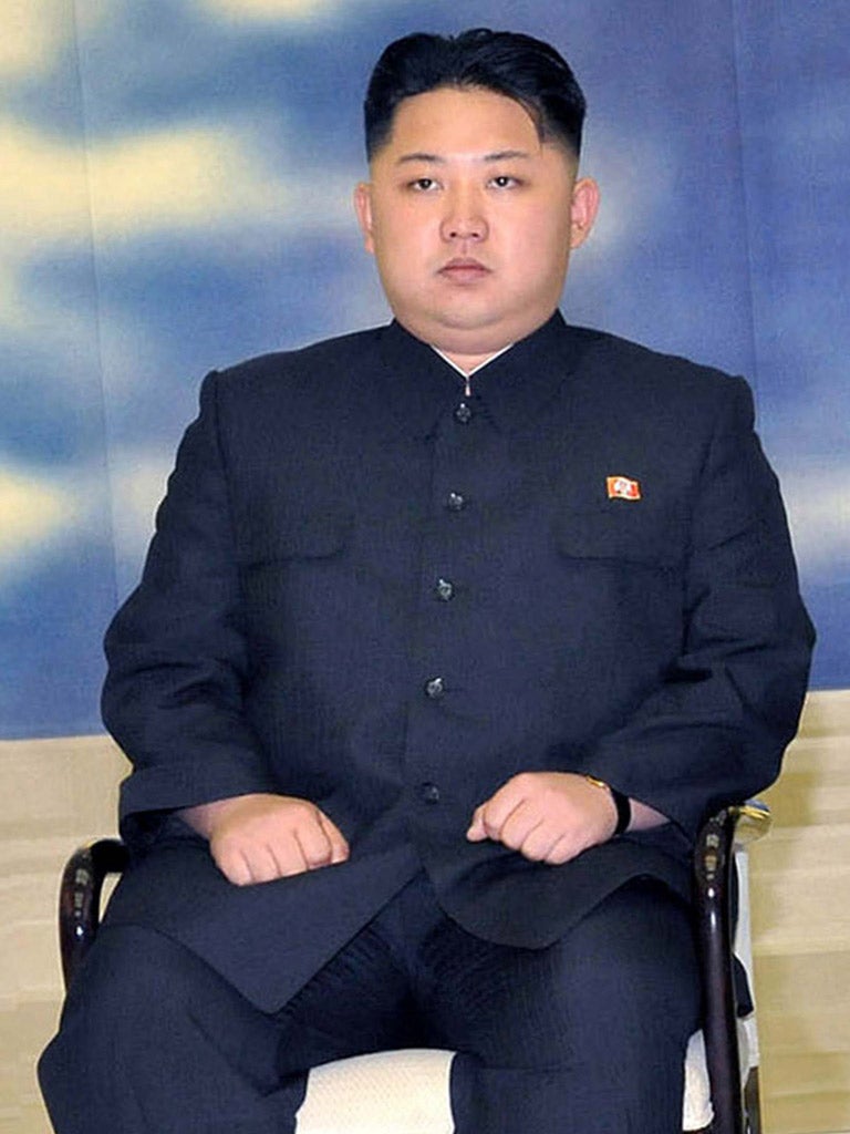 Kim Jong-Un, youngest son of former North Korean leader Kim Jong-Il, sitting during a meeting with his father and visiting Lao President