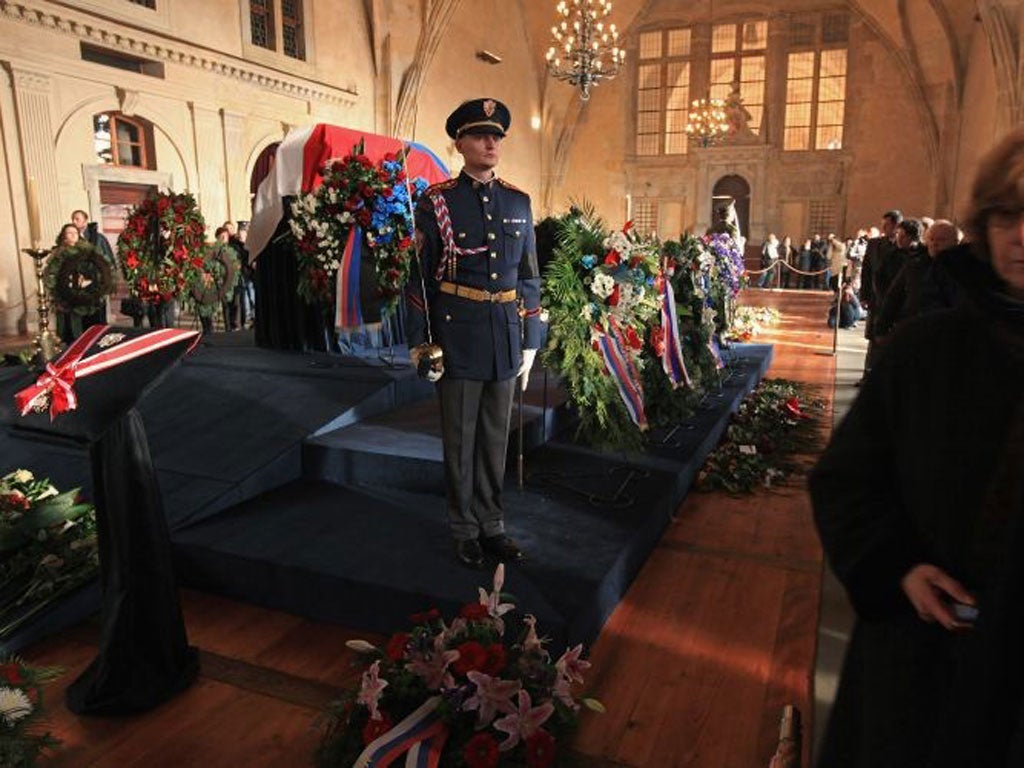 Members of the honour guard stand by Havel's coffin in Prague Castle