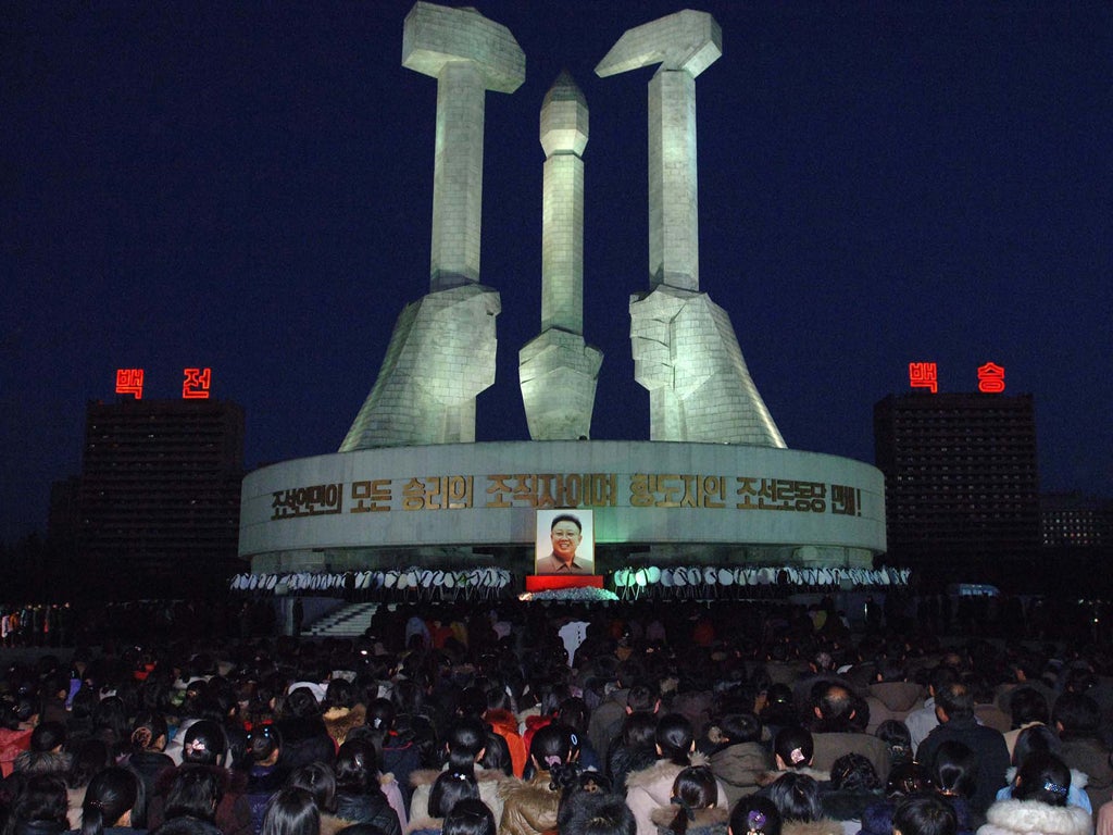 North Koreans mourn the dictator at a monument in Pyongyang