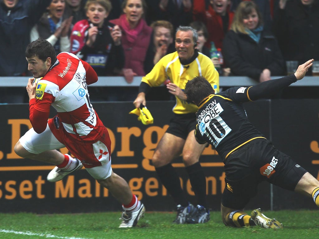 Gloucester’s Jonny May beats Nick Robinson to score