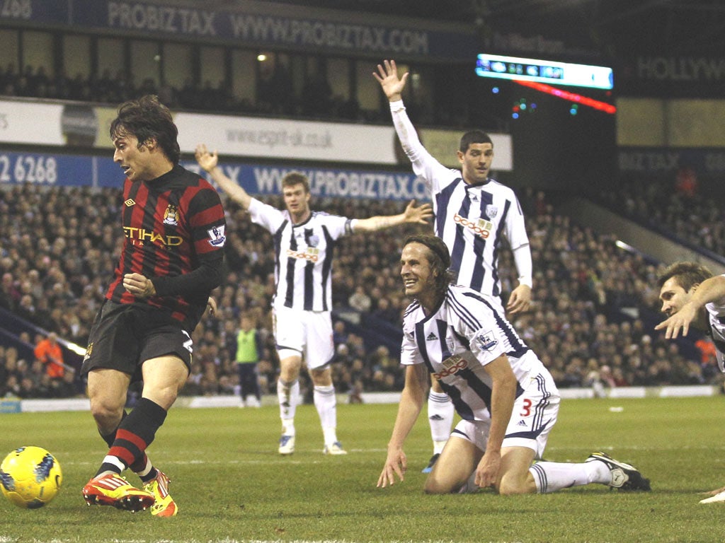 The West Bromwich Albion defence appeal for offside as Manchester City’s dangerman David Silva shoots