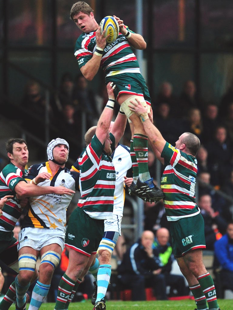 Ed Slater leaps high to win a line-out for Leicester at Sixways