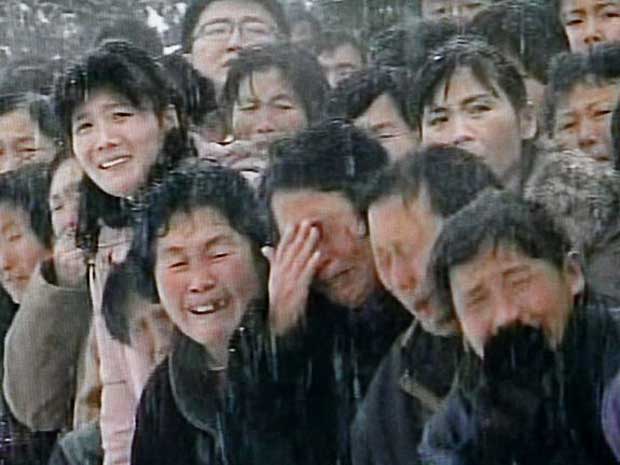 Mourners weep during the funeral procession for North Korean leader Kim Jong-il in snowy Pyongyang