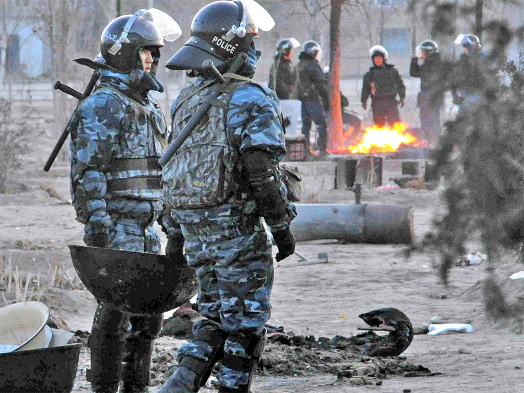 Police patrol Zhanaozen, scene of violent clashes