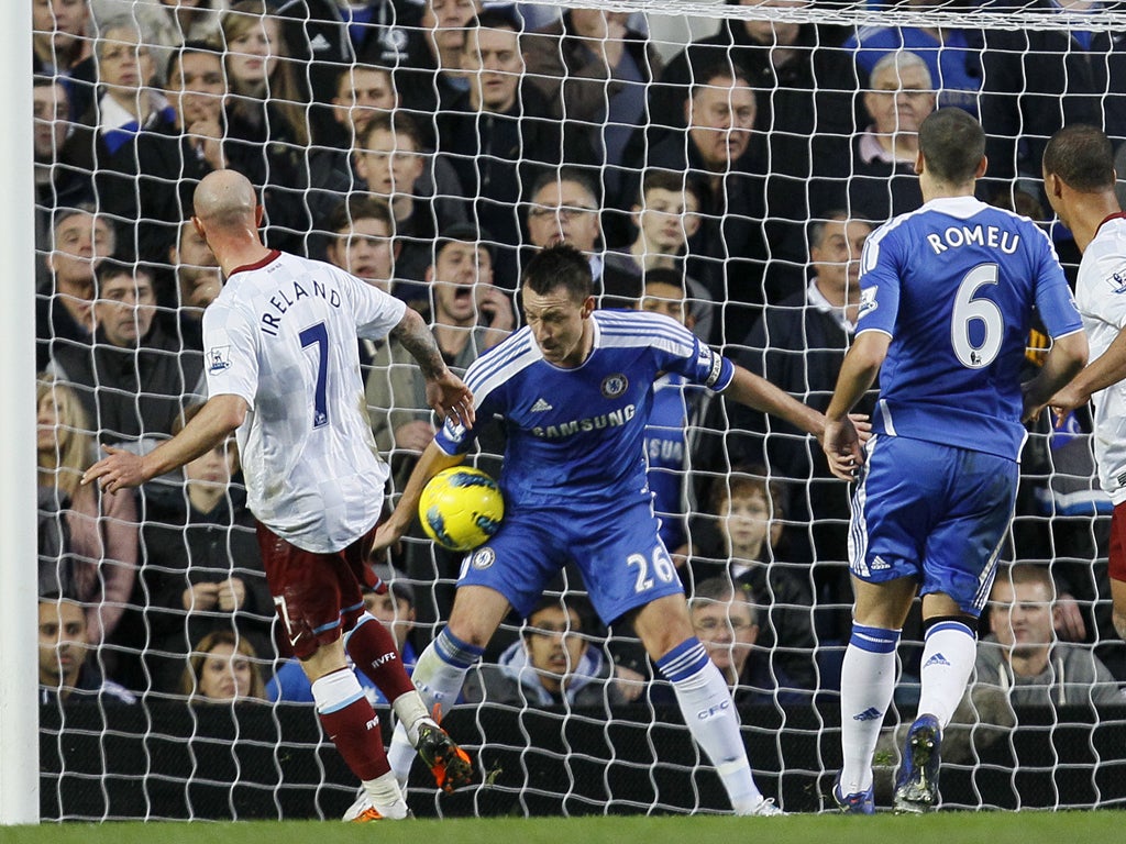 John Terry blocks Ireland's shot on the line but appeals for hand-ball are not required as the Villa man knocked in the rebound