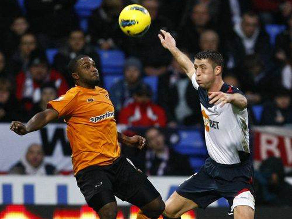 Bolton's Gary Cahill (right) vies with Sylvan Ebanks-Blake