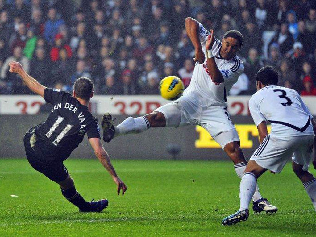 Rafael Van der Vaart scores for Spurs despite the attentions of Ashley Williams and Neil Taylor