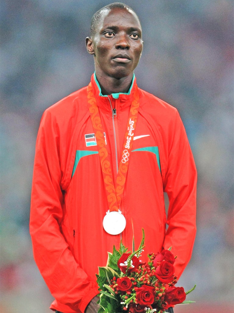 Asbel Kiprop receiving a silver medal in Beijing