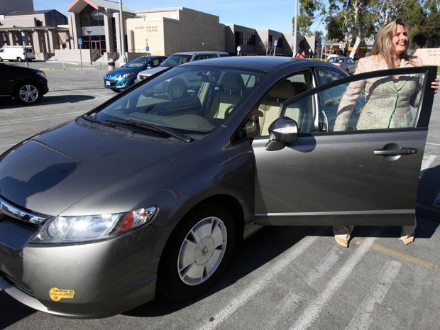 Heather Peters, who says her 2006 Honda Civic Hybrid never achieved the 50 mpg Honda claimed in its advertising