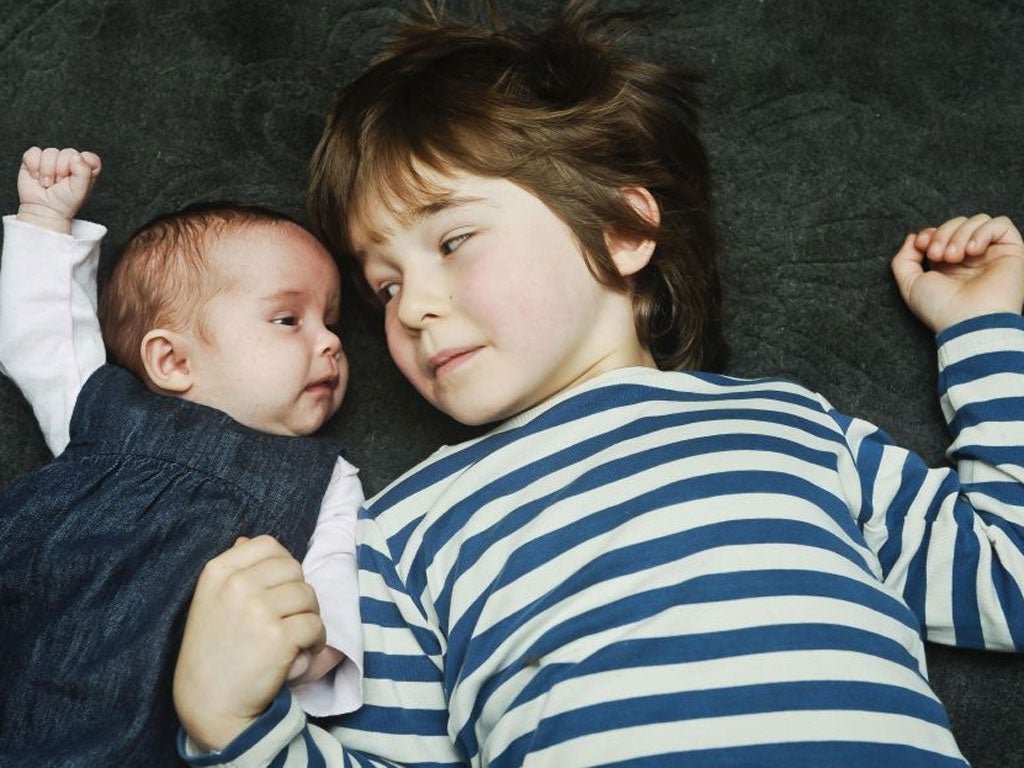 Reuben, five, with his seven-week-old sister Floren