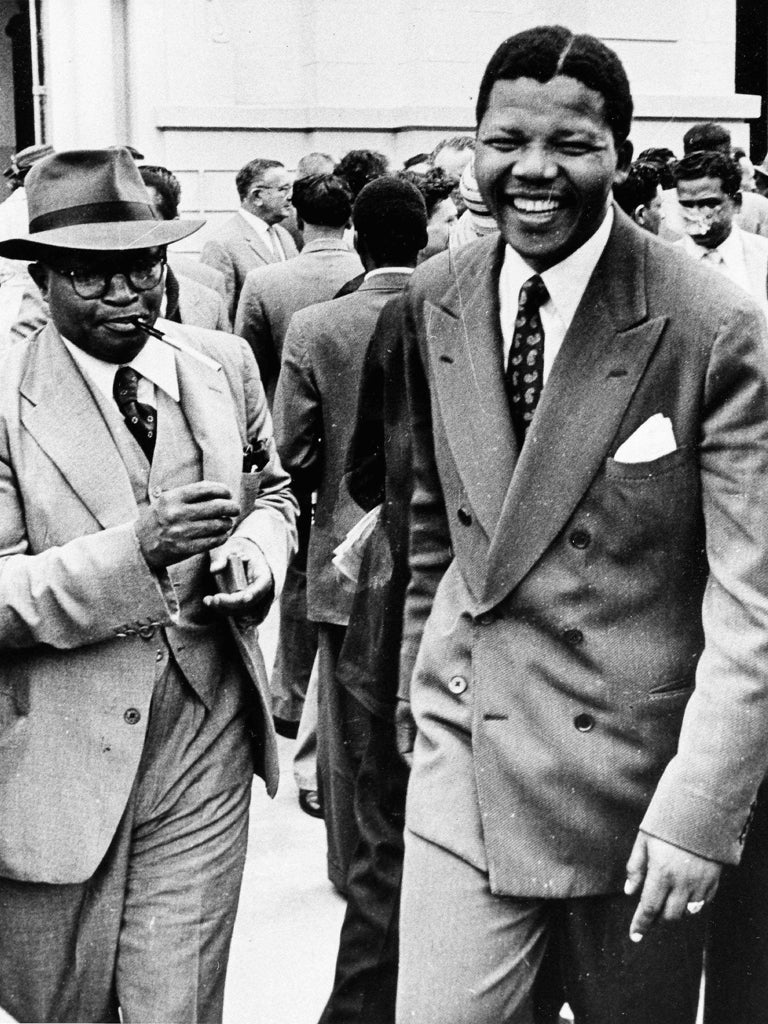 Nelson Mandela leaves court in Pretoria during the first treason trial in 1958