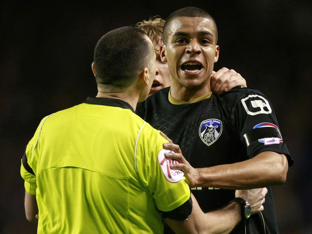 Oldham defender Tom Adeyemi reacts to alleged abuse