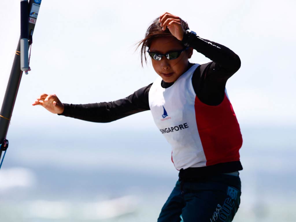 Kimberly Lim of Singapore celebrates winning the Optimist world championship in Napier, New Zealand