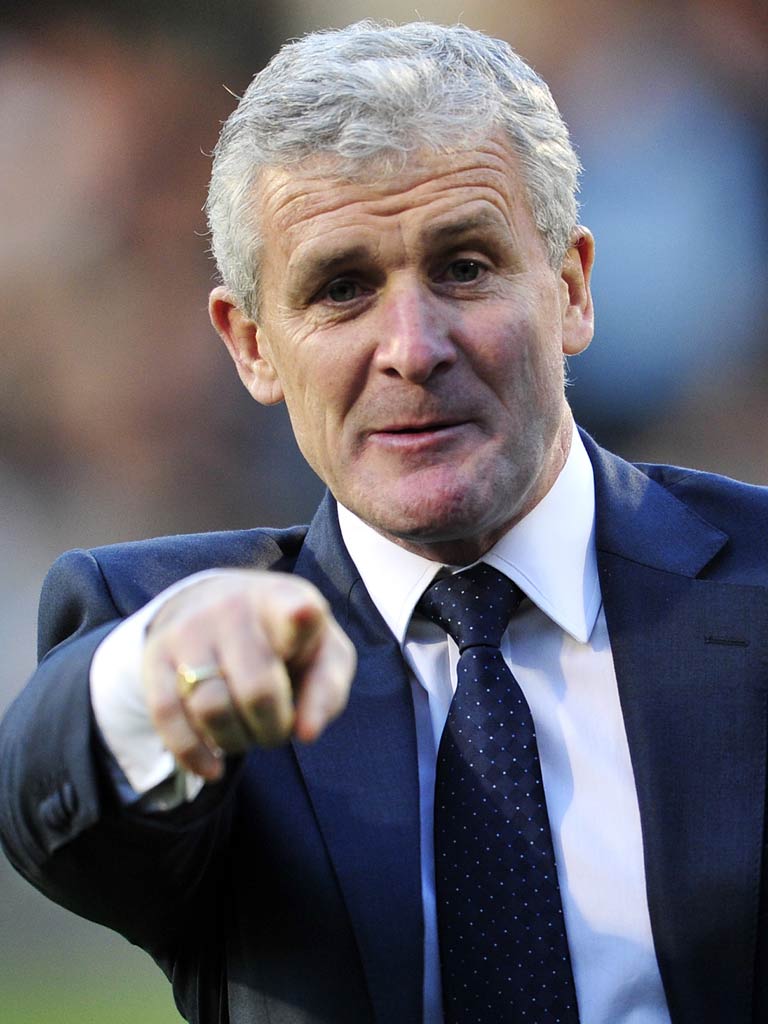 Mark Hughes has signed a two-and-a-half year contract with QPR