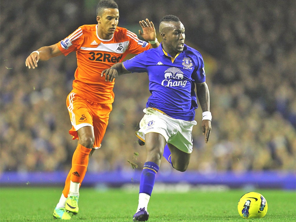 Everton's Royston Drenthe, pictured tussling with Swansea's Scott Sinclair, has been one of David Moyes's low-budget signings