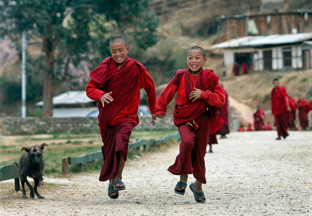 Young monks run back to class at the Dechen Phodrang monastery in Thimpu