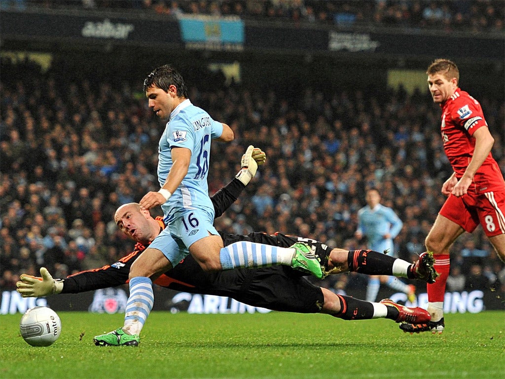 Pepe Reina dives at Sergio Aguero's feet last night