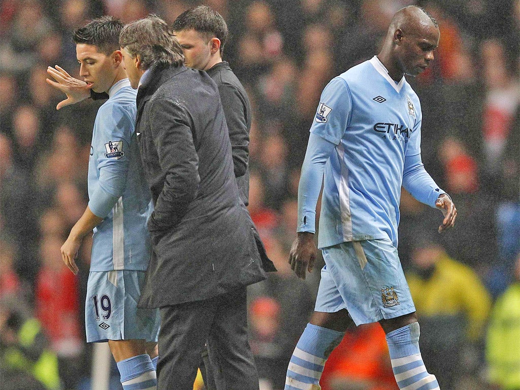 Mario Balotelli and Roberto Mancini go their separate ways