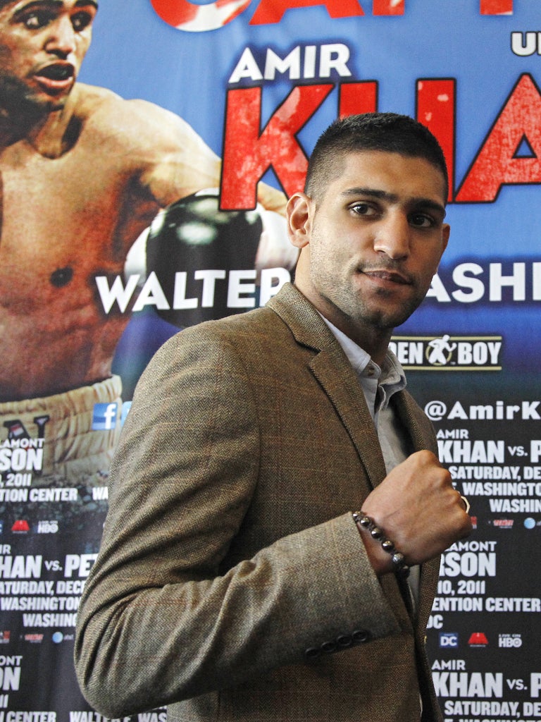 Amir Khan who lost his WBA and IBF titles in a split-decision defeat in Peterson's Washington DC hometown on 10 December