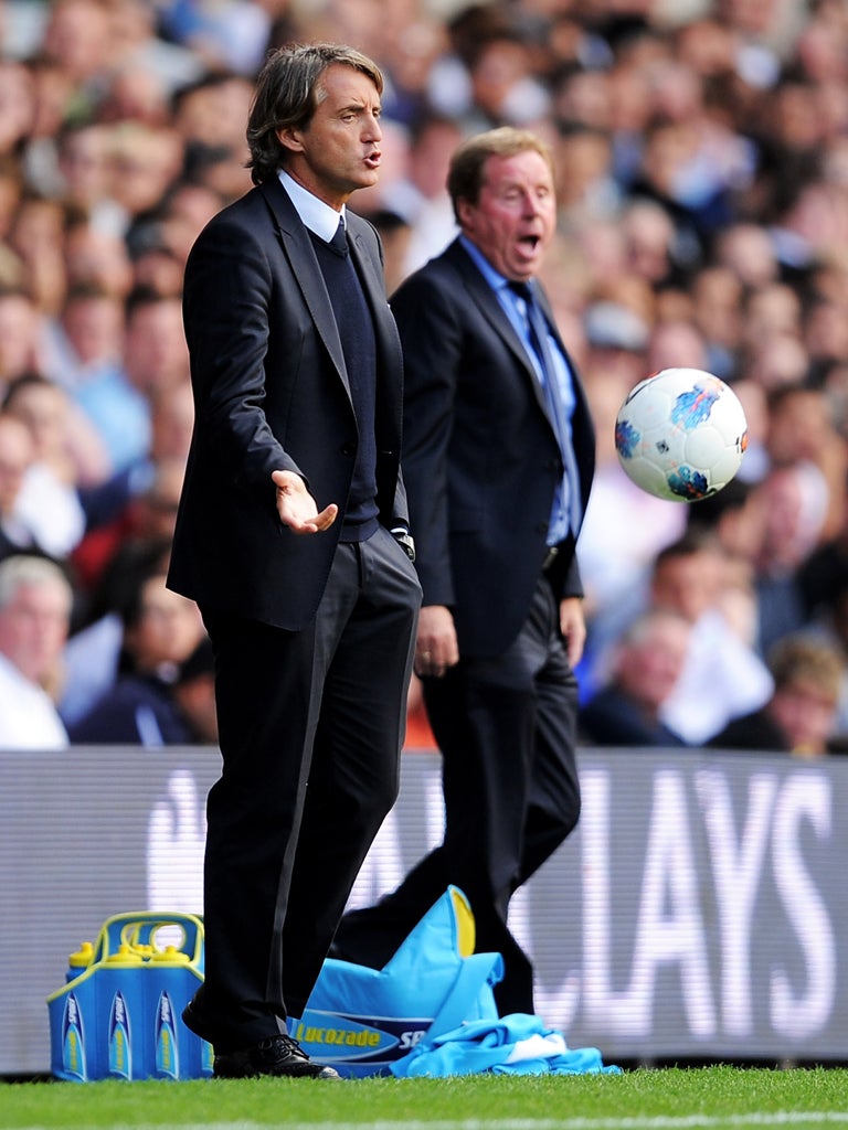 Roberto Mancini (far left) and Harry Redknapp are at odds over claims of 'buying' success