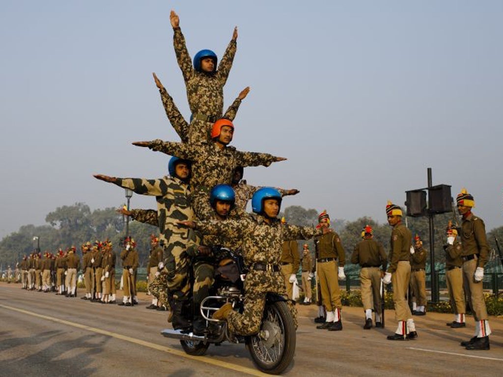 Indian soldiers perfect their stunts on Royal Enfield motorcycles in preparation for India's Republic Day on 26 January