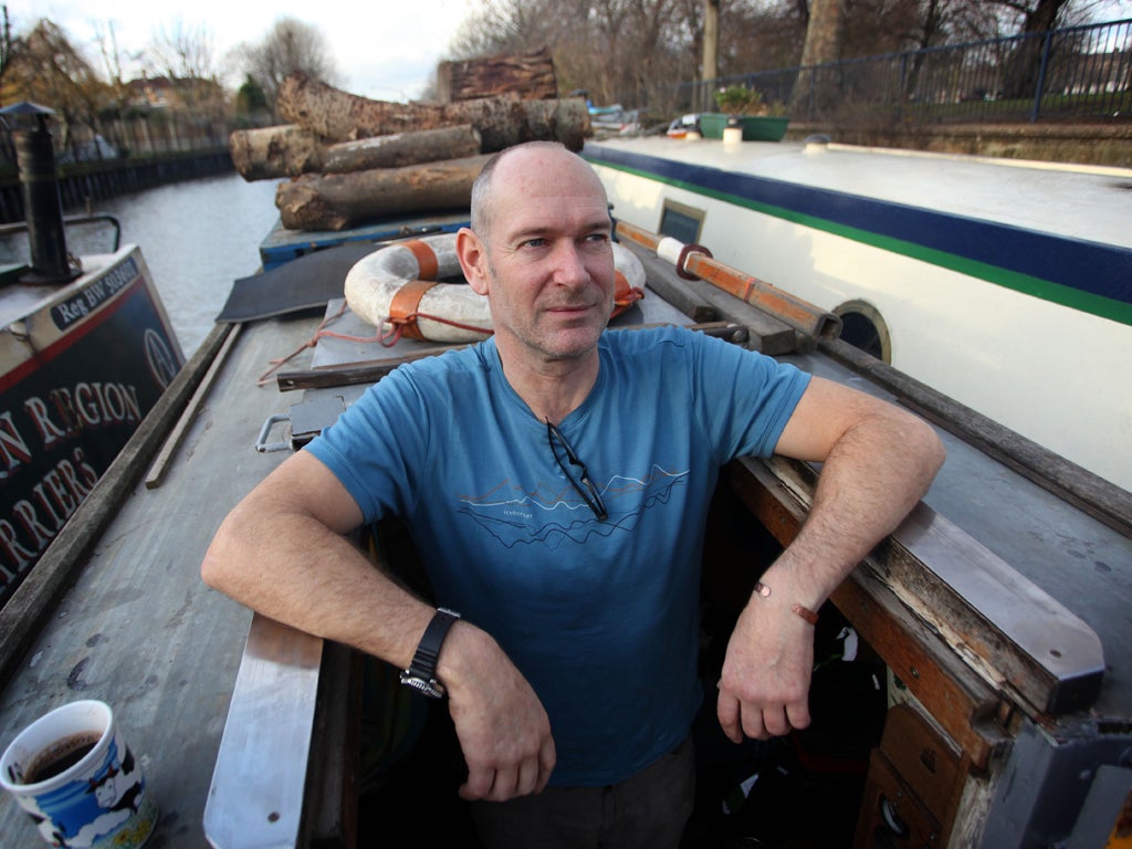 Mike Wells pictured on his home moored along the Regents Canal in Hackney