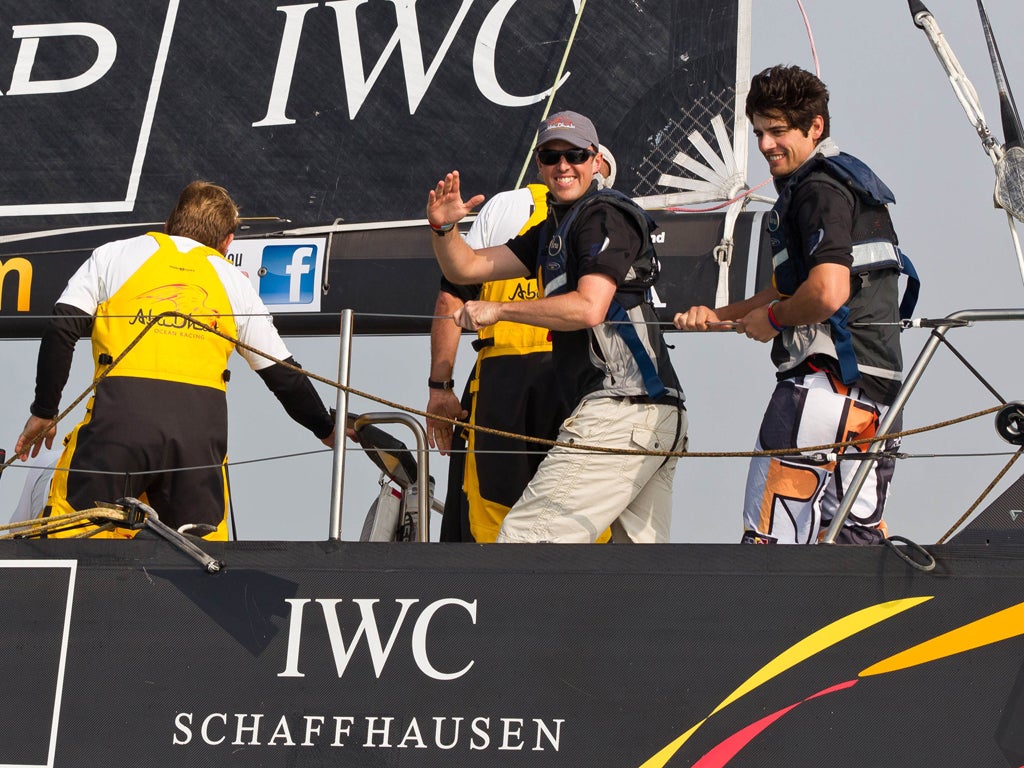 Alistair Cook, right, and Graeme Swann, centre, onboard Abu Dhabi Ocean Racing