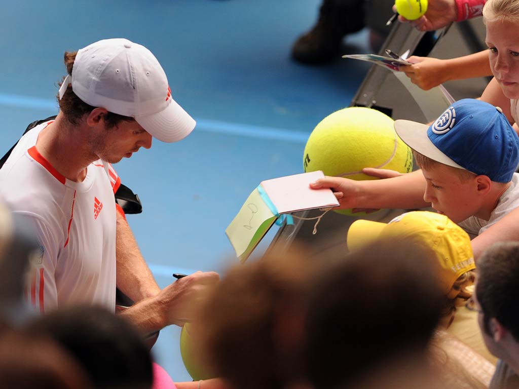 Day 2 Andy Murray overcame a first-set scare to see off Ryan Harrison in the first round on Day 2 of the Open.