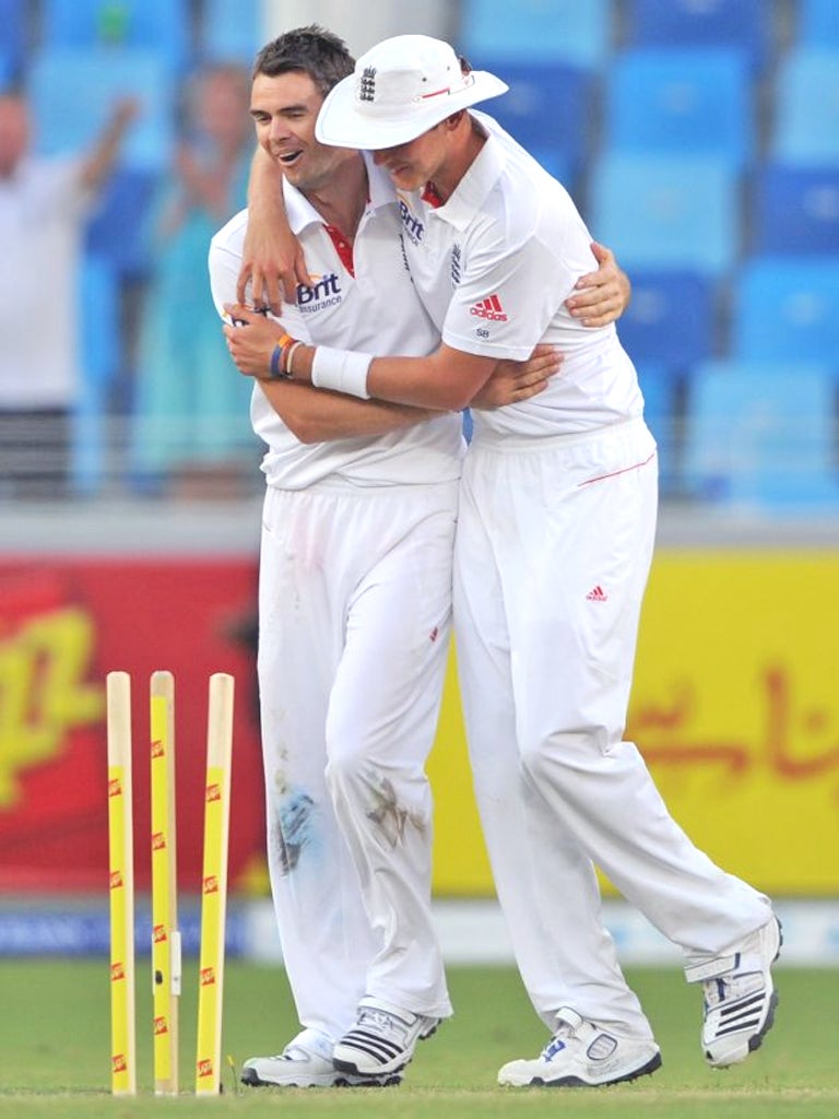 James Anderson gets a Stuart Broad hug after taking Abdur Rehman's wicket