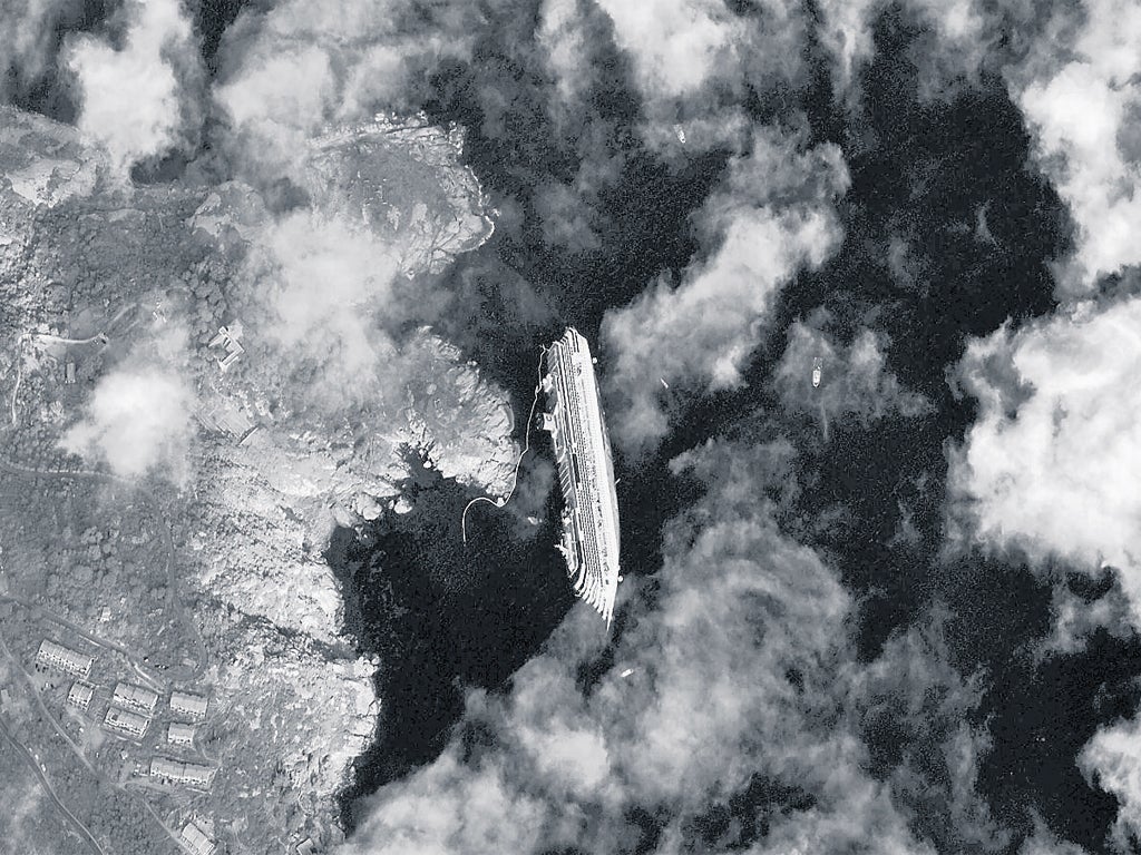 The stricken Costa Concordia shown yesterday in a satellite
photograph