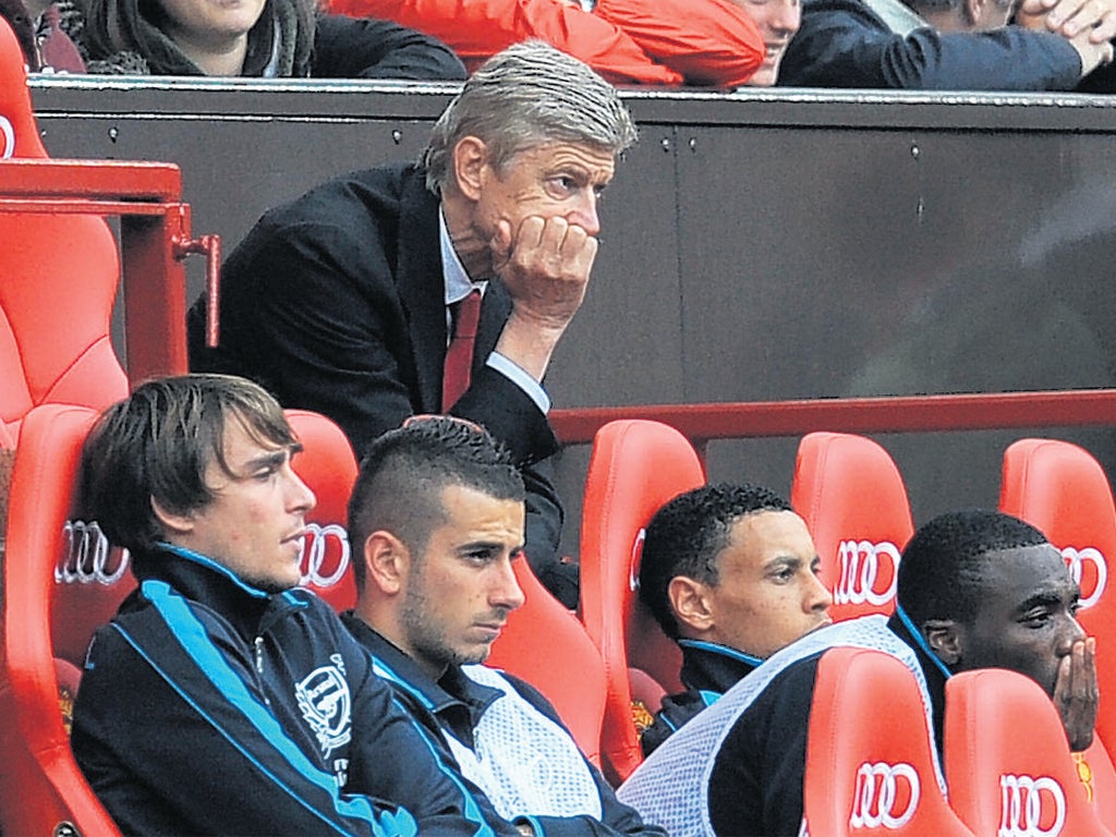 Arsène Wenger suffers during Arsenal's collapse against Manchester United at Old Trafford