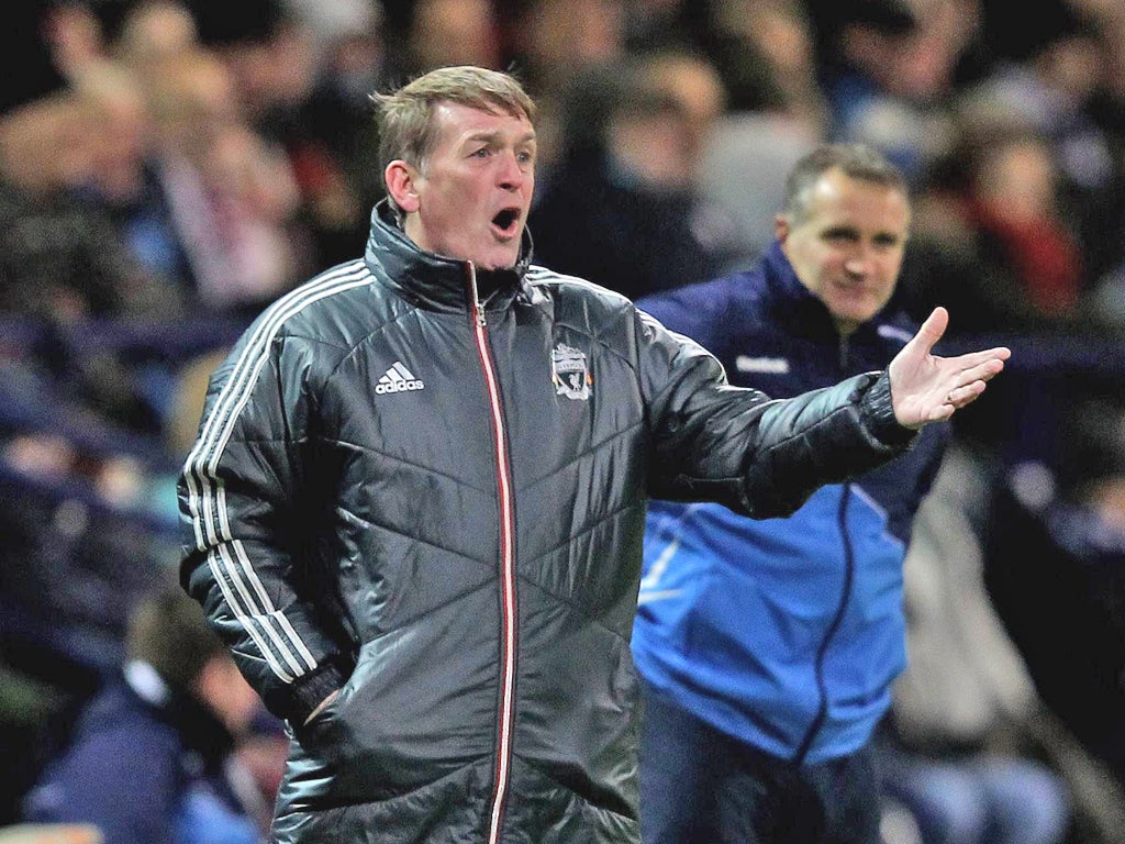 Soundly thrashed: Liverpool manager Kenny Dalglish cuts an unhappy figure on the touchline during last night’s match at the Reebok