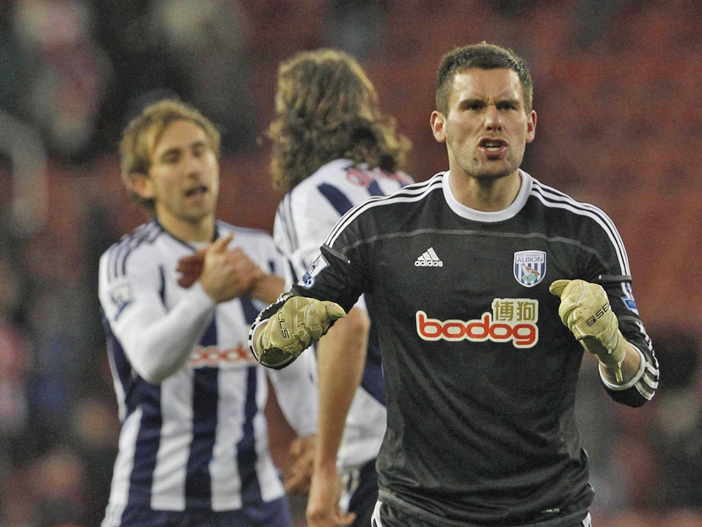 Start the celebration: Ben Foster, who saved a penalty from Jonathan Walters, enjoys the moment of victory