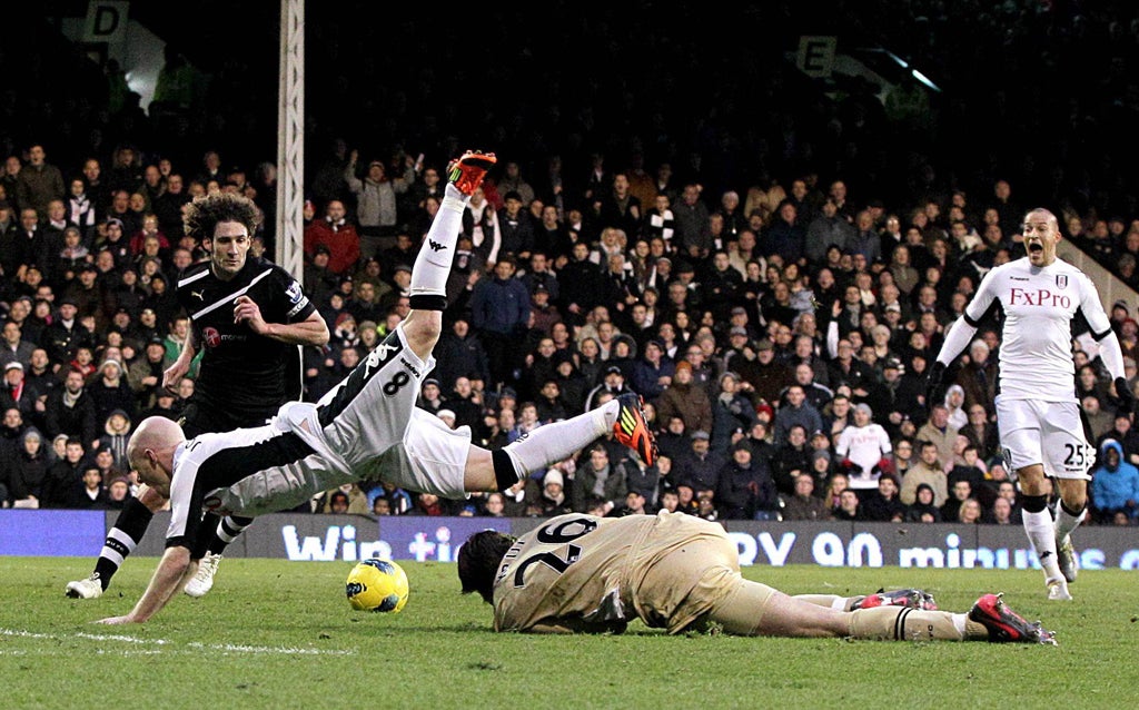 Andy Johnson is sent tumbling by goalkeeper Tim Krul, which led to Fulham’s second penalty