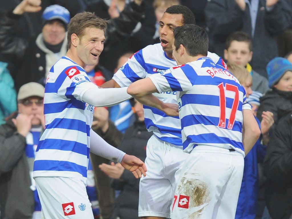 Akos Buzsaky (left) is congratulated after scoring QPR’s second