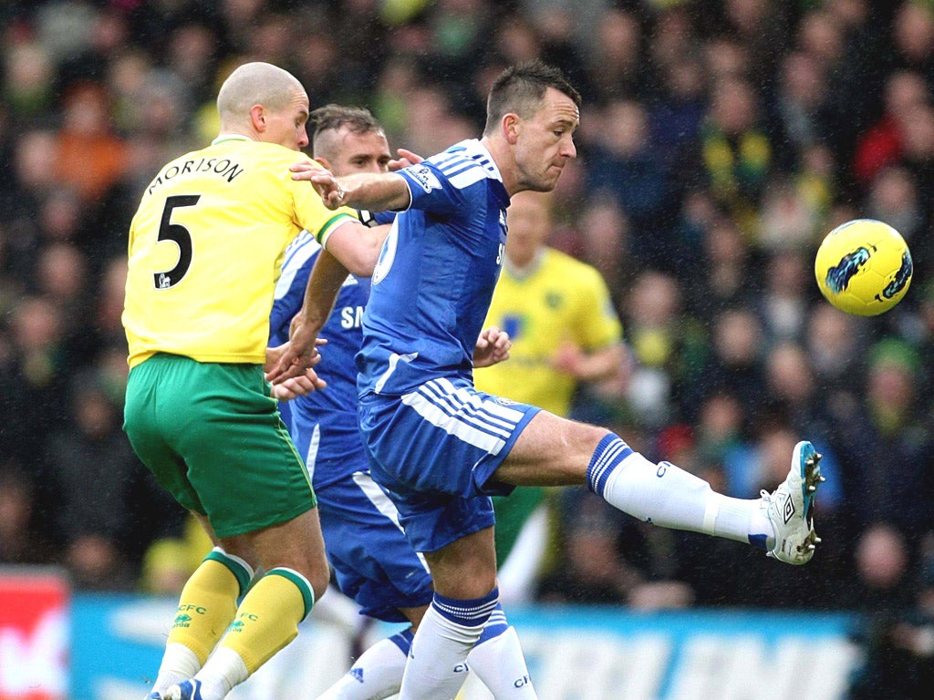 John Terry battles for the ball with Norwich’s Steve Morison