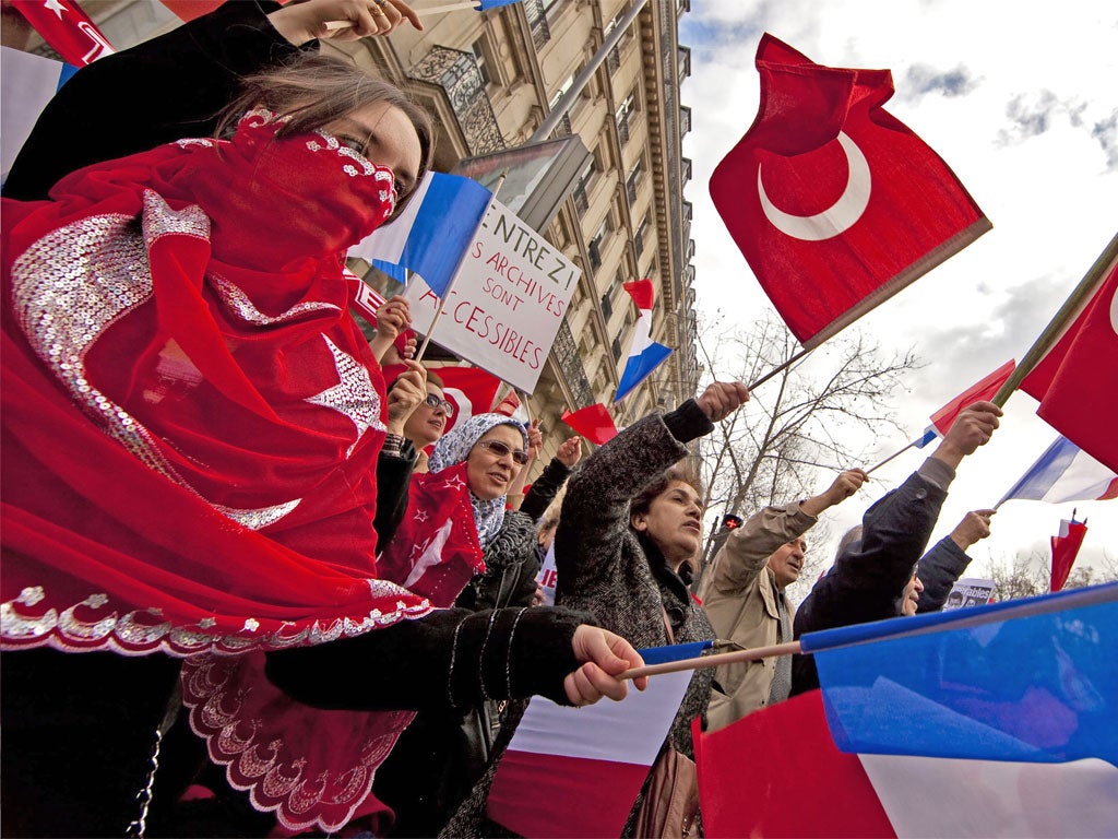 Franco-Turkish protesters rally outside the Senate in Paris yesterday